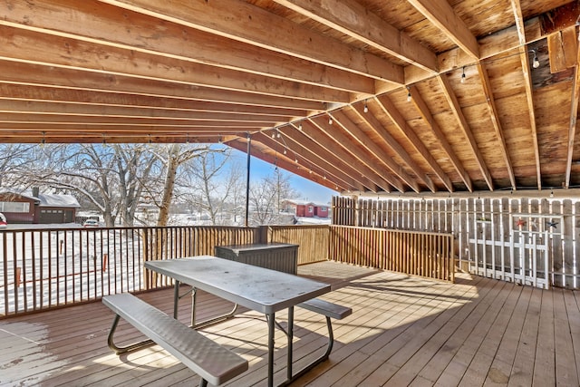 wooden terrace with outdoor dining area