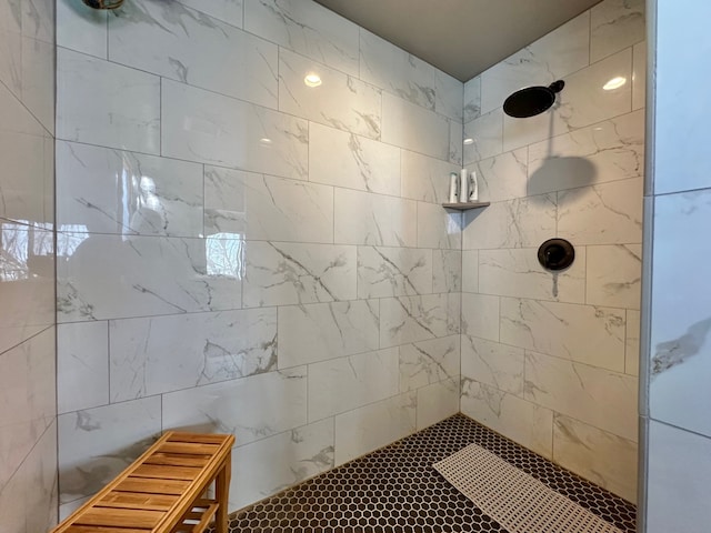 full bath featuring a tile shower