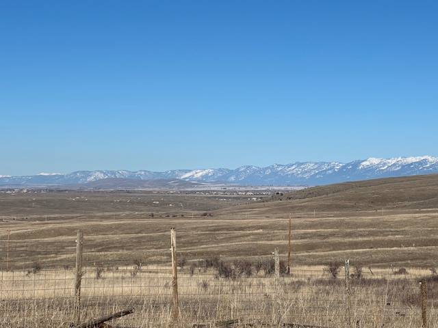 view of mountain feature with a rural view