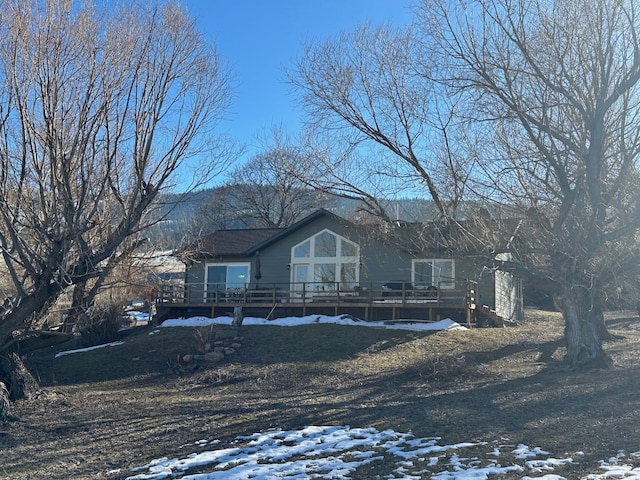 view of front of property with a wooden deck