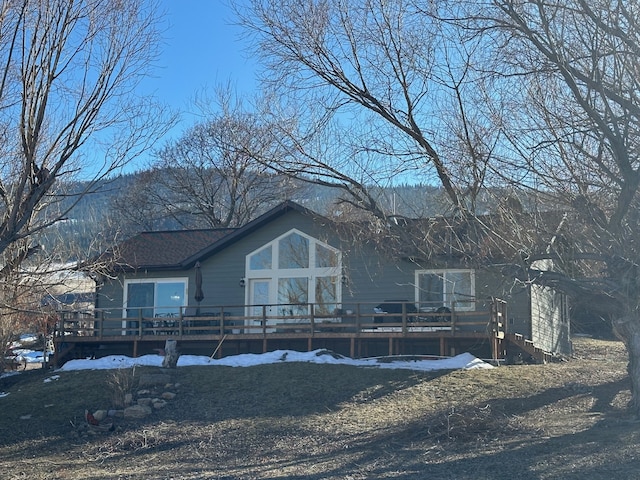 view of front of property featuring a wooden deck