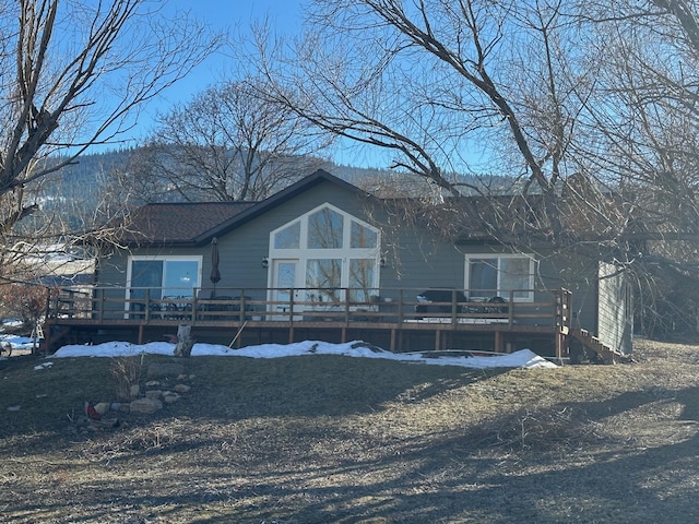 view of front of property featuring a wooden deck