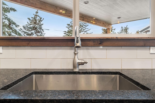 interior details featuring white cabinets, a sink, and modern cabinets