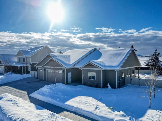 view of front of house with a garage, driveway, and board and batten siding