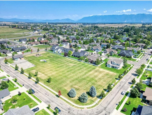 birds eye view of property with a residential view and a mountain view