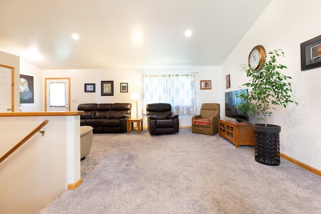 living room featuring baseboards, recessed lighting, and light colored carpet