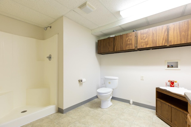 full bathroom with a paneled ceiling, a shower stall, visible vents, and vanity