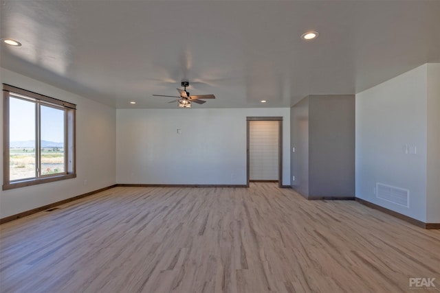 spare room featuring ceiling fan, recessed lighting, visible vents, baseboards, and light wood finished floors