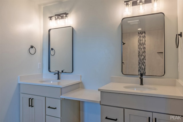 full bath featuring two vanities and a sink