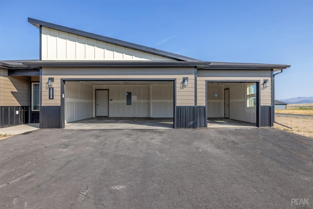 view of front of property with a garage and driveway