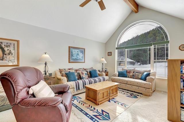 living room featuring ceiling fan, beam ceiling, a wealth of natural light, and light colored carpet