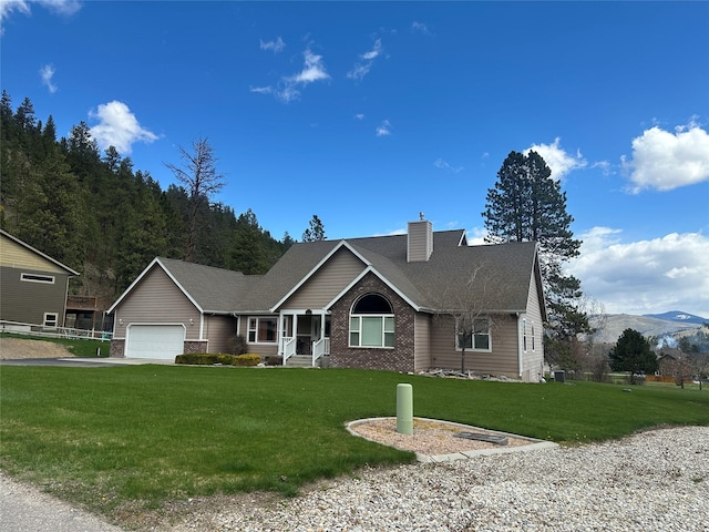ranch-style home with a chimney, a front lawn, driveway, and an attached garage