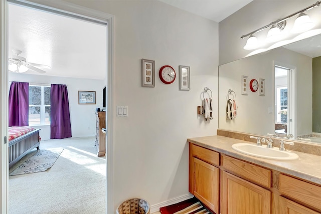 bathroom with vanity and a ceiling fan