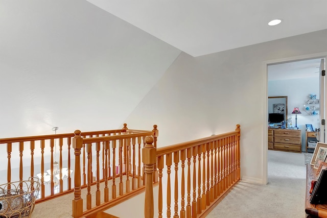 corridor with light carpet, recessed lighting, and baseboards