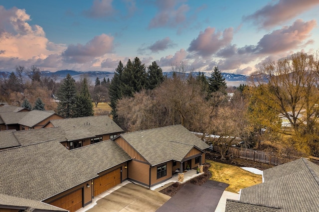 birds eye view of property with a mountain view