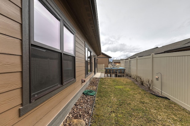 view of yard featuring a patio area and fence