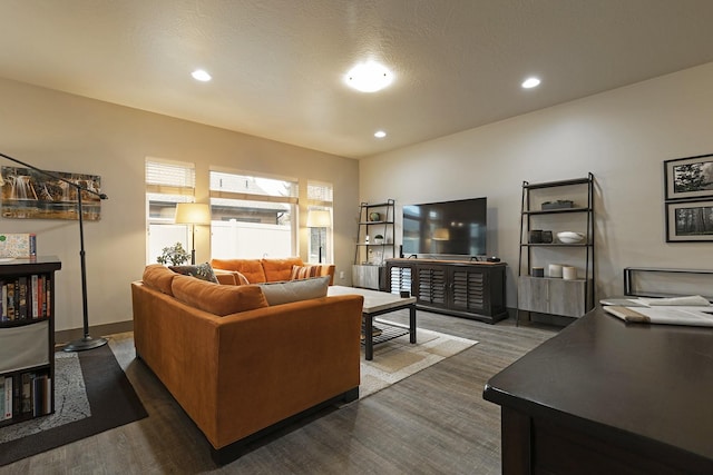 living room with recessed lighting and baseboards