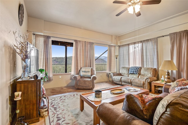 living area featuring ceiling fan