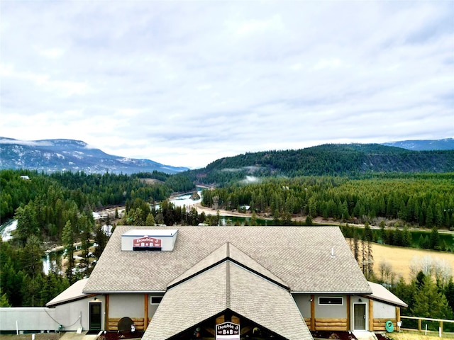 property view of mountains with a wooded view