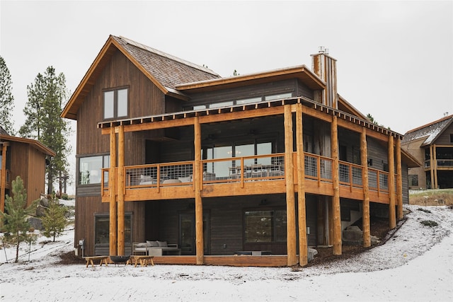 30 Ninebark Way, Eureka, MT 59917 - snow covered property featuring a chimney