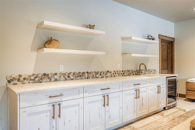 30 Ninebark Way, Eureka, MT 59917 - bar featuring a sink, baseboards, and beverage cooler