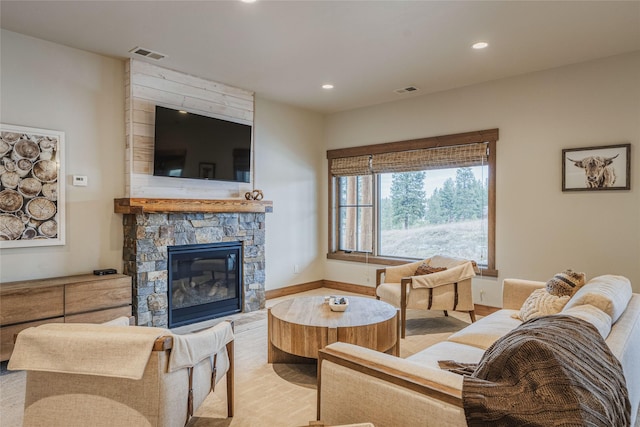 30 Ninebark Way, Eureka, MT 59917 - living area featuring a stone fireplace, recessed lighting, and visible vents