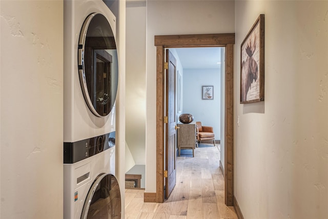 30 Ninebark Way, Eureka, MT 59917 - laundry room featuring light wood-style floors, laundry area, and stacked washer / drying machine