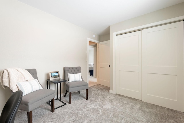 sitting room with light colored carpet