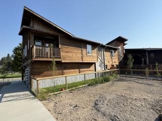 view of side of property featuring fence