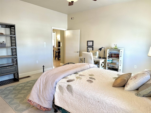 carpeted bedroom with visible vents and baseboards