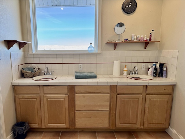 full bathroom featuring tile patterned flooring, backsplash, and baseboards