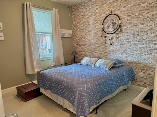 carpeted bedroom featuring baseboards