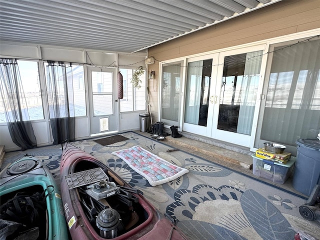 sunroom / solarium featuring french doors