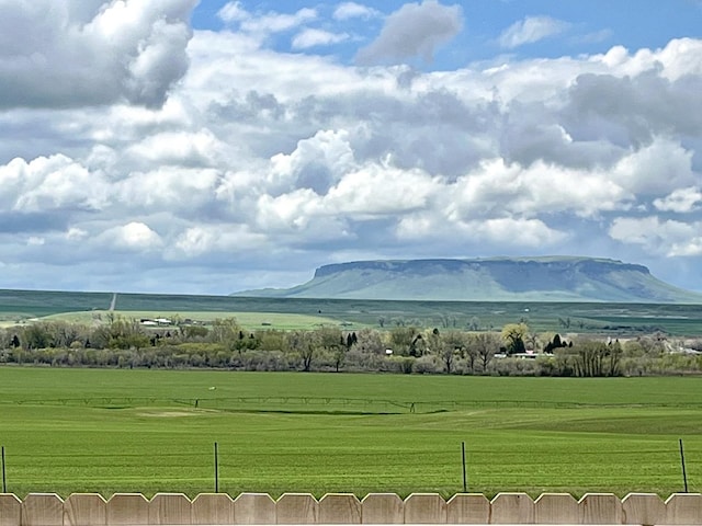 mountain view featuring a rural view