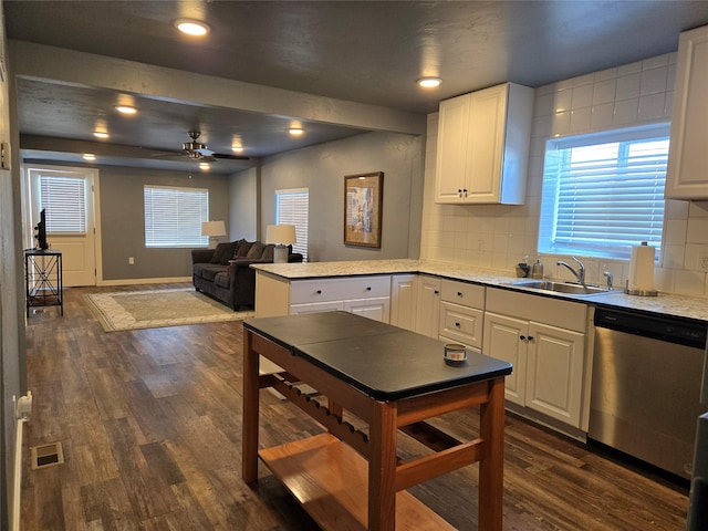 kitchen featuring visible vents, white cabinets, open floor plan, light countertops, and dishwasher