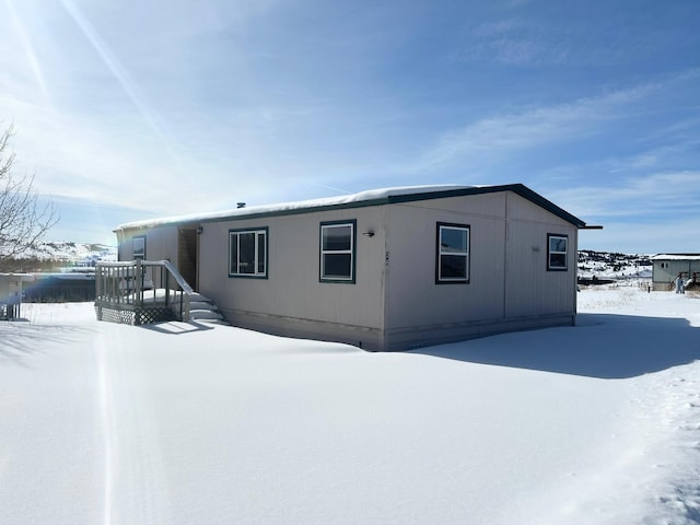 view of snow covered house