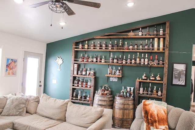 bar featuring a dry bar and a ceiling fan