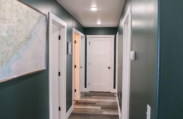 hallway with dark wood finished floors