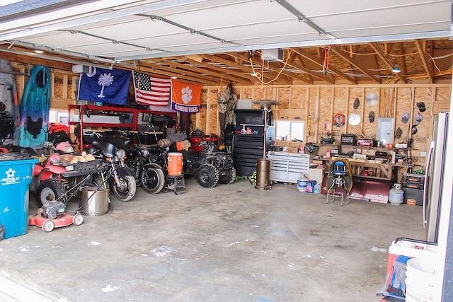 garage featuring a workshop area and a garage door opener