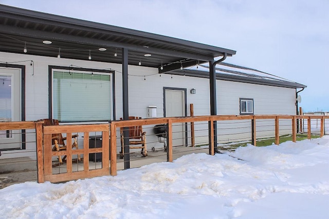 view of snow covered house