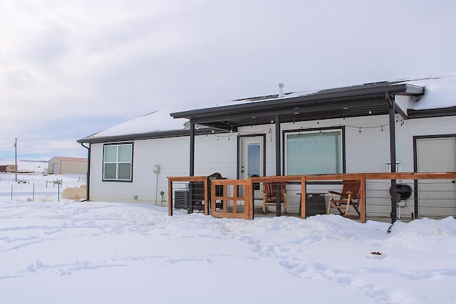 view of snow covered house