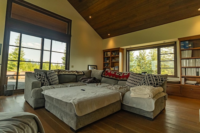 living area with dark wood-style floors, high vaulted ceiling, and wood ceiling