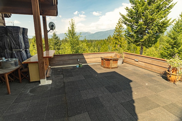 view of patio / terrace with a mountain view