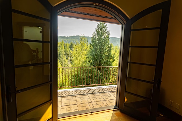 doorway to outside featuring a view of trees