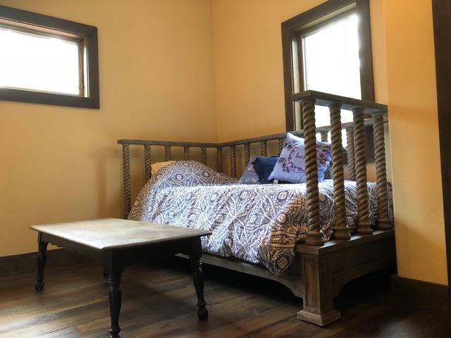 161 Tanglewood Ln, Whitefish, MT 59937 - bedroom with multiple windows and wood finished floors