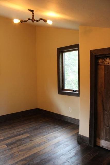 161 Tanglewood Ln, Whitefish, MT 59937 - spare room with dark wood finished floors and baseboards