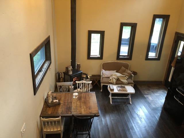 161 Tanglewood Ln, Whitefish, MT 59937 - living area featuring dark wood finished floors and a wood stove