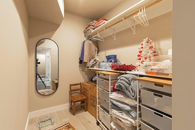 walk in closet featuring light wood-style floors