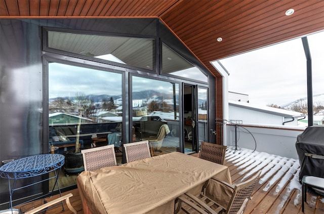 exterior space featuring outdoor dining area and a mountain view