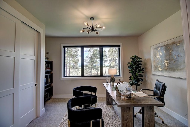 home office with light carpet, a notable chandelier, and baseboards